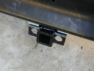 Trailer hitch mounted on the school bus bumper