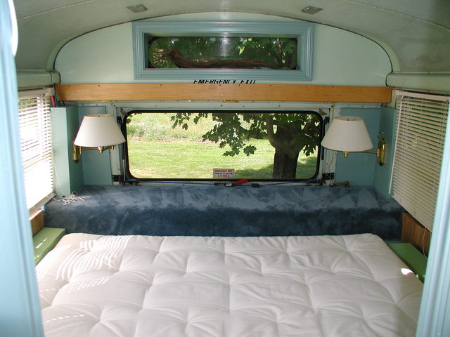 the back wall of the bus master bedroom